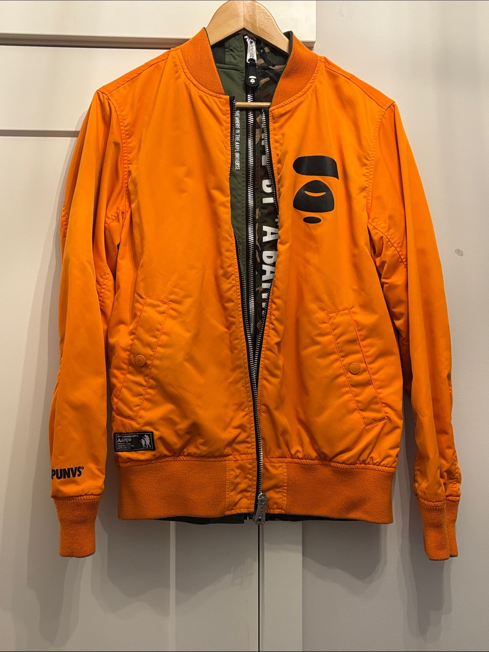 AAPE by A Bathing Ape × Alpha Industries Reversible L-2B Bomber Jacket.